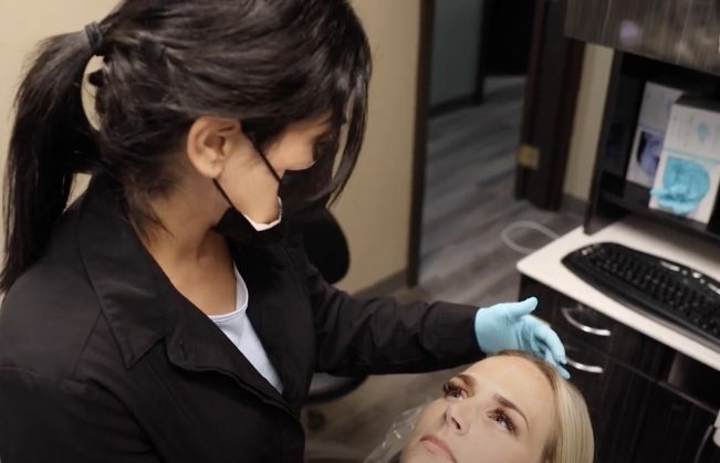 Dentist talking to a dental patient about Botox