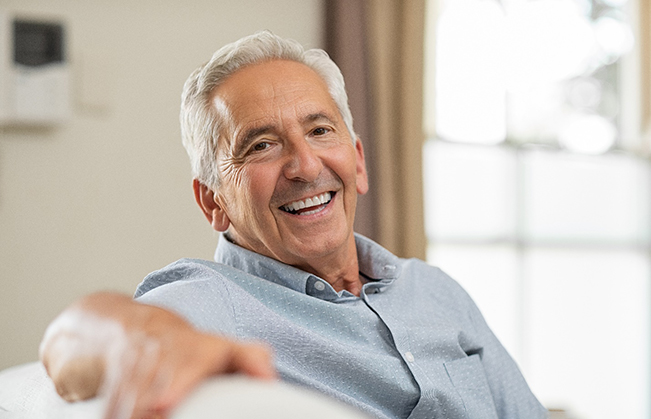 man smiling after getting dental implants 