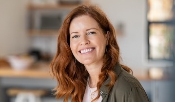 Smiling woman with orange hair