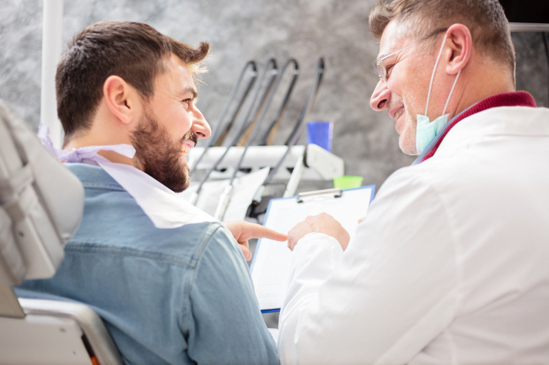 Patient smiling at their cosmetic dentistry consultation